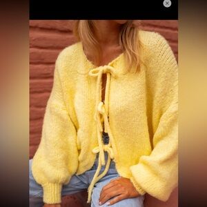 Yellow cardigan. Knitted